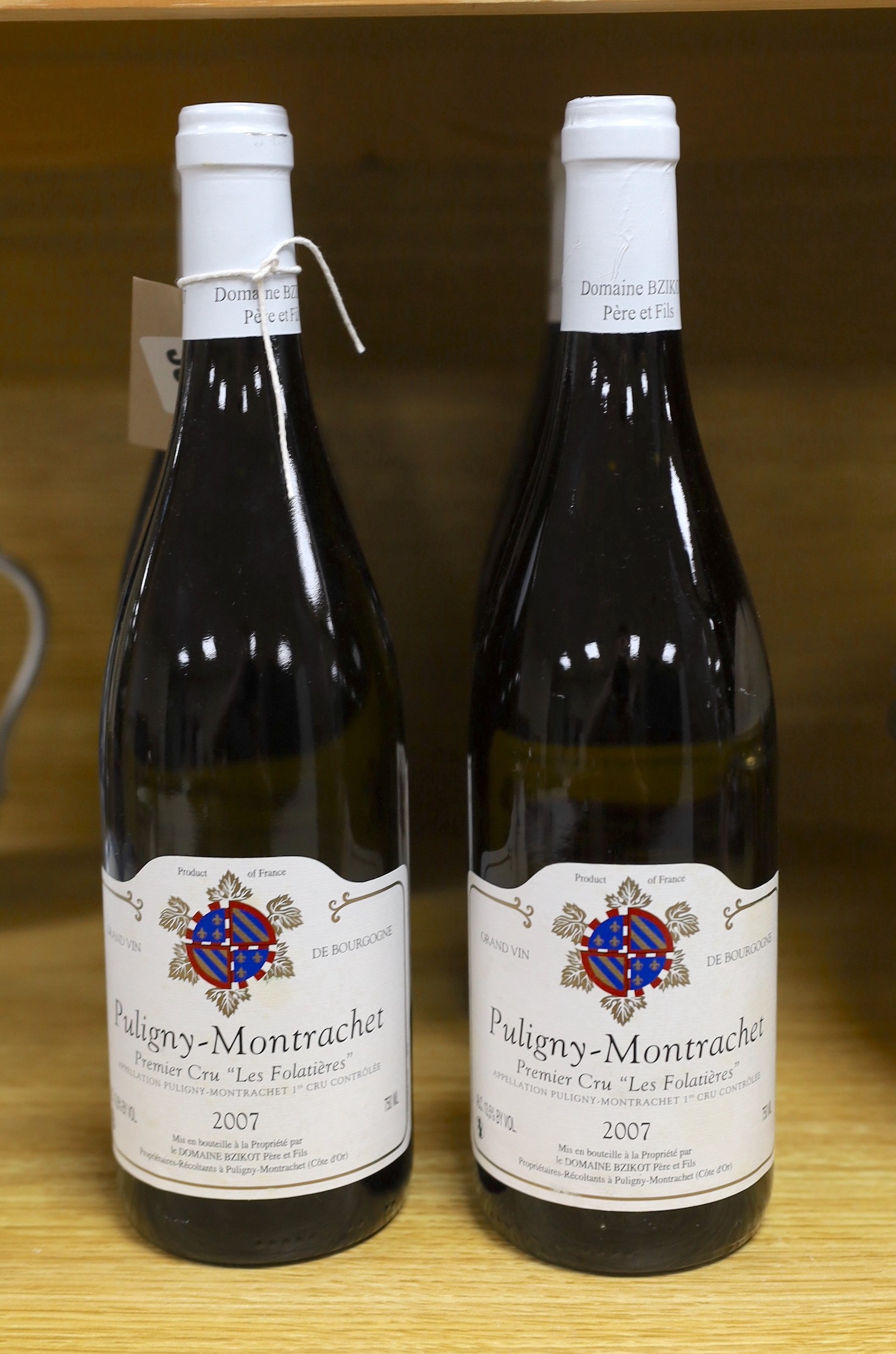 Six bottles of Domaine Bzikot Pere et Fils Puligny Montrachet 1er Cru Les Folatieres, 2007